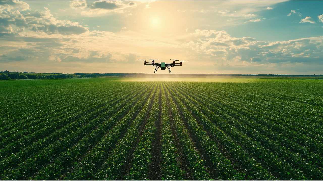 A drone equipped with spectral imaging technology sprays crops in a vast agricultural field at sunset, highlighting advancements in precision farming and data-driven crop management.