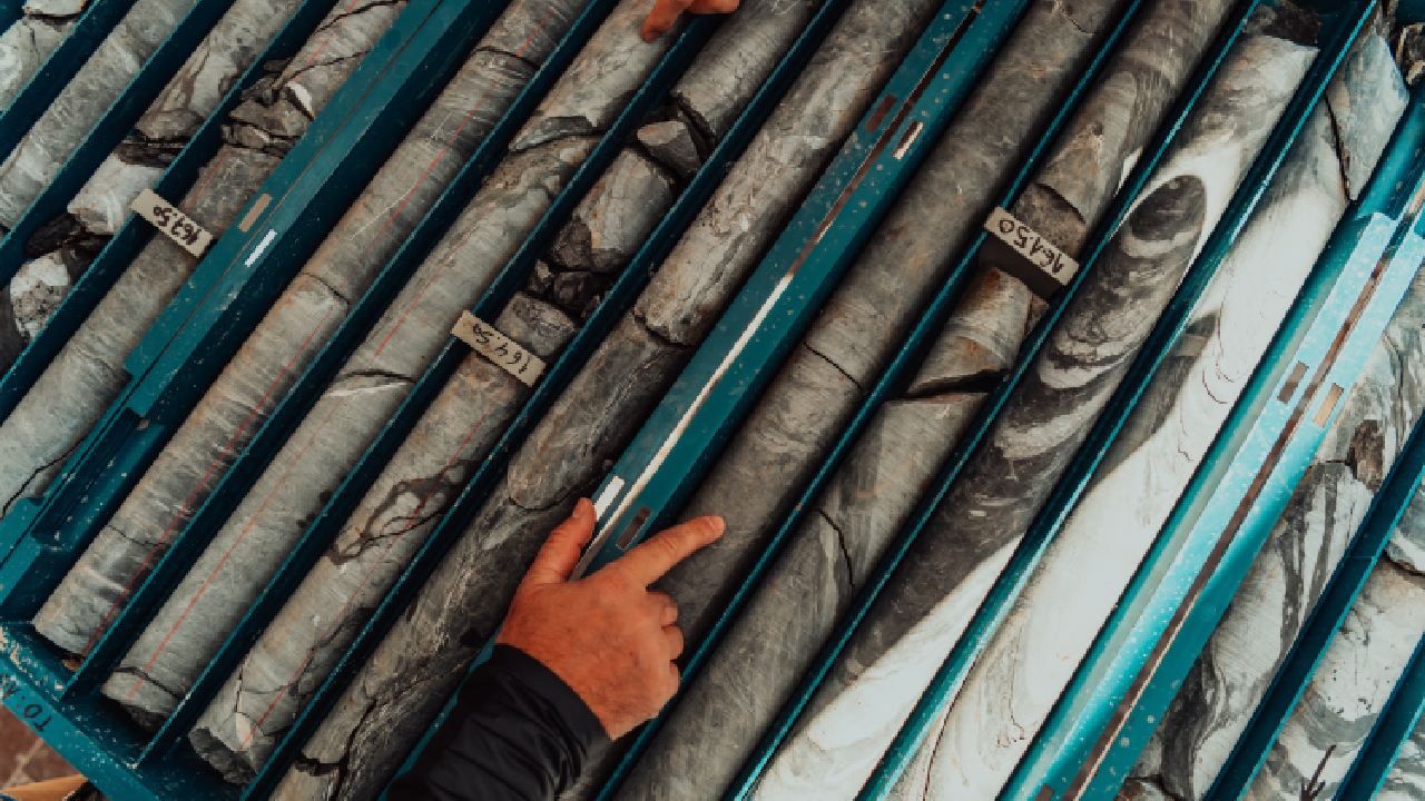 It's Rarely the Spectrometer: What Actually Causes Bad Field Spectral Data 1 Geological gold core samples with team of mining workers measuring drilled rock top view